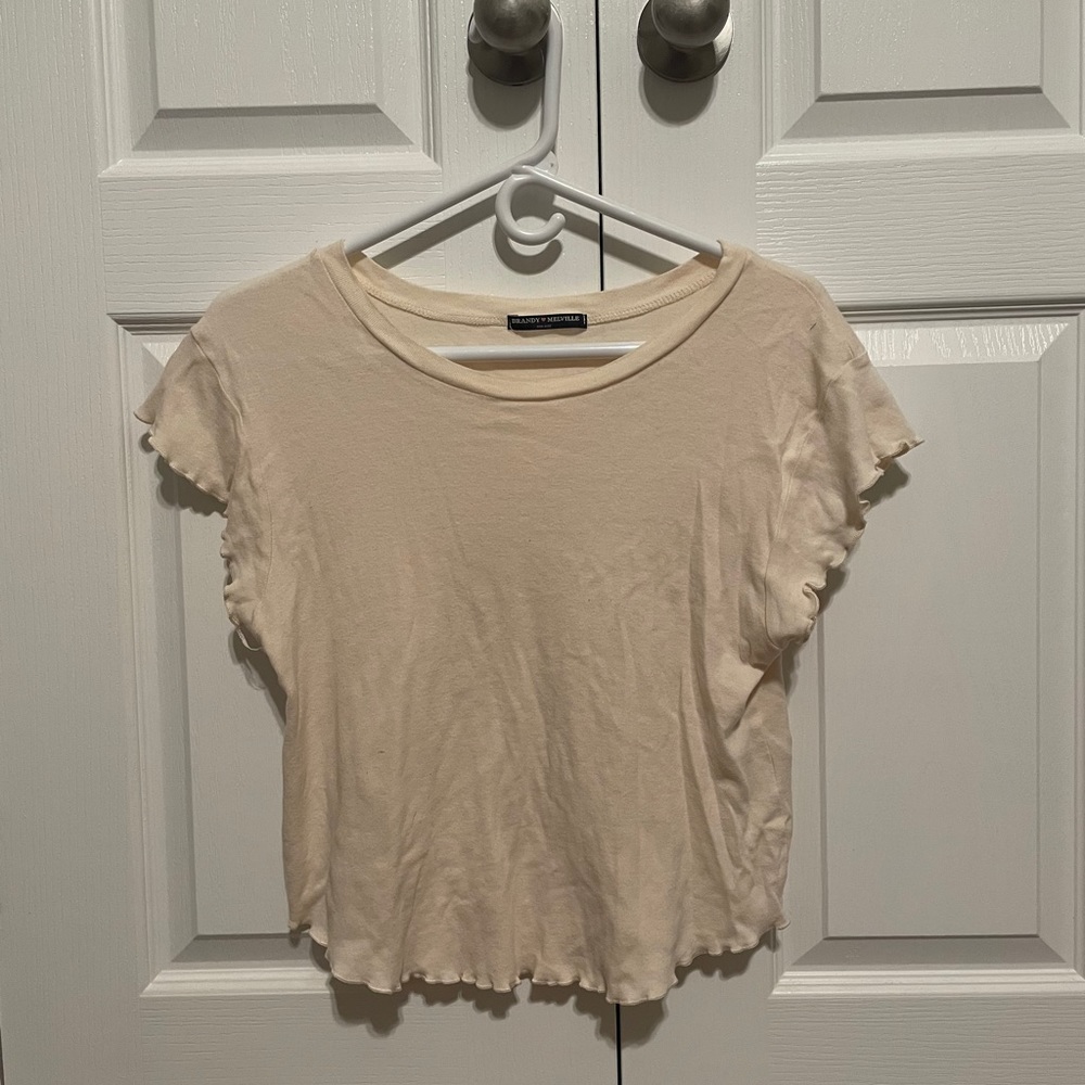 NWOT Brandy Melville ruffle cream t shirt
